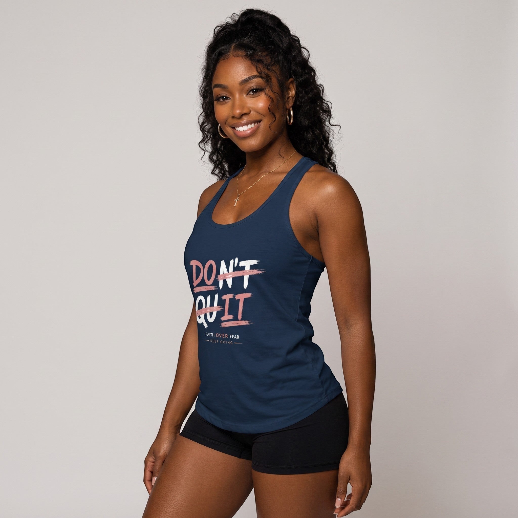 Spirit & Strings navy racerback tank top with Don't Quit Do It graphic print worn by a smiling woman